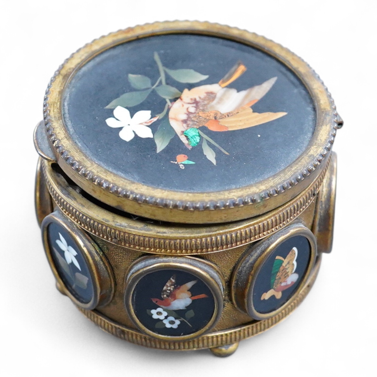 A Victorian pietra dura gilt metal circular box with hinged lid, 7.5cm in diameter